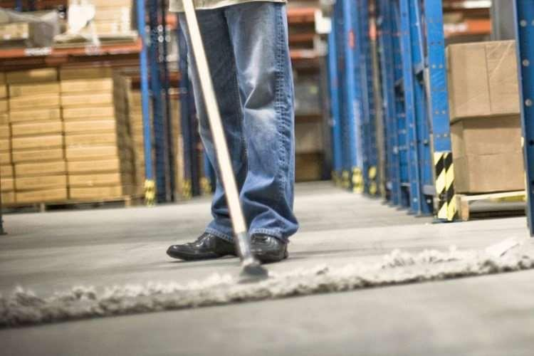 Industrial cleaning work in a warehouse environment